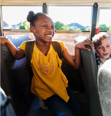 Students riding on a school bus together