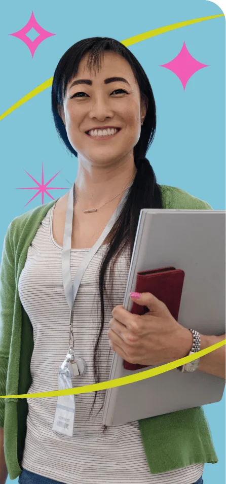 Smiling teacher with a laptop in her hands.